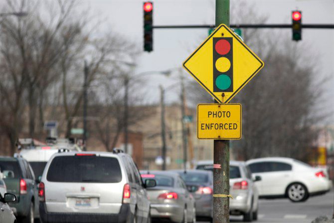 Red Light Cameras: A Necessary Evil? Red Light Cameras: A Necessary Evil?
